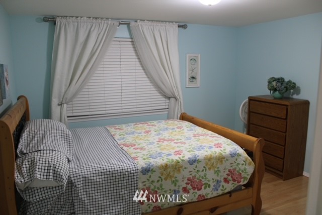 4910 193rd Lane Southwest Rochester, WA 98579 - Photo 18 of 25 a bedroom with a bed and a window