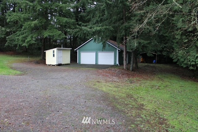 4910 193rd Lane Southwest Rochester, WA 98579 - Photo 3 of 25 a view of a house with a yard and large tree