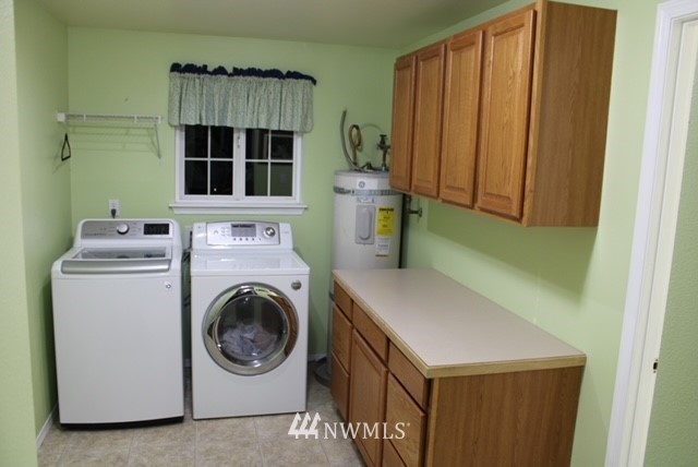 4910 193rd Lane Southwest Rochester, WA 98579 - Photo 21 of 25 a utility room with dryer and washer