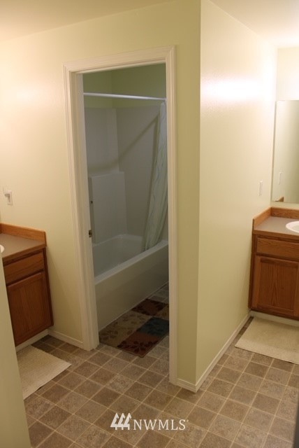 4910 193rd Lane Southwest Rochester, WA 98579 - Photo 22 of 25 a bathroom with a sink and a shower