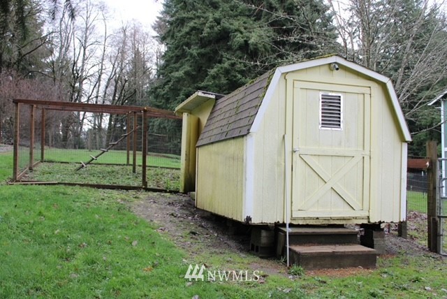 4910 193rd Lane Southwest Rochester, WA 98579 - Photo 6 of 25 a view of a tiny house with a yard