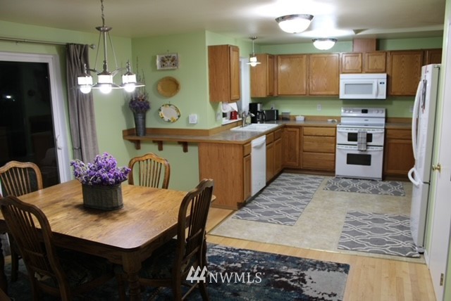4910 193rd Lane Southwest Rochester, WA 98579 - Photo 9 of 25 a kitchen with a table and chairs in it