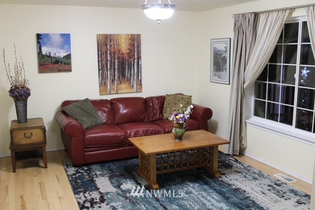 4910 193rd Lane Southwest Rochester, WA 98579 - Photo 10 of 25 a living room with furniture and a window