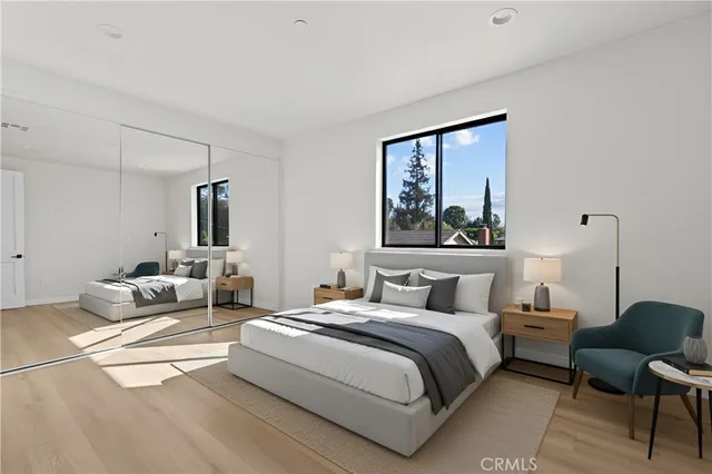 a bedroom with double bed and a window