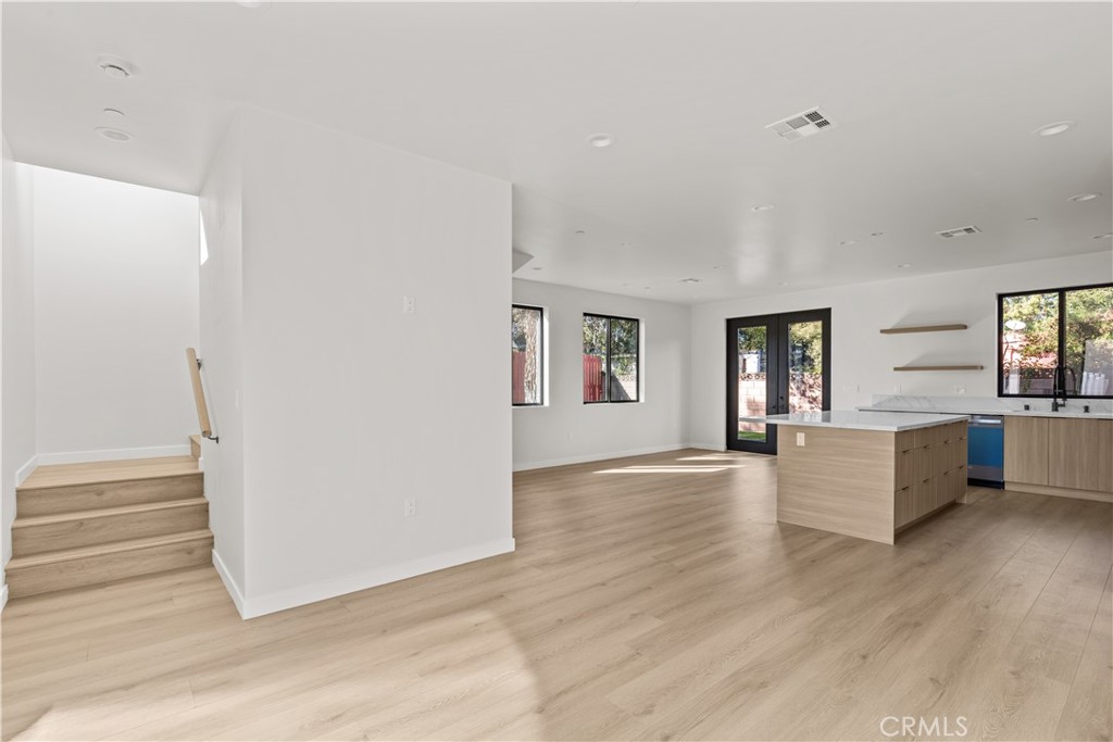 11145 Hortense Street North Hollywood, CA 91602 - Photo 8 of 15 a view of empty room with wooden floor and fireplace