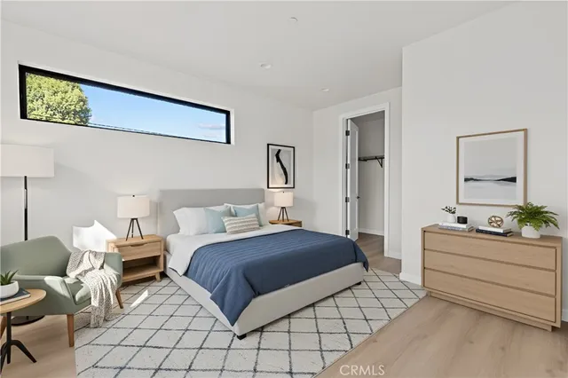 a bedroom with a bed and window