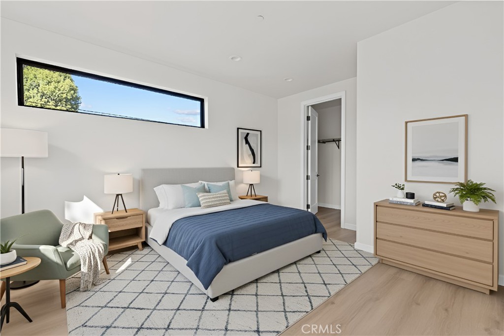 11145 Hortense Street North Hollywood, CA 91602 - Photo 10 of 15 a bedroom with a bed and window