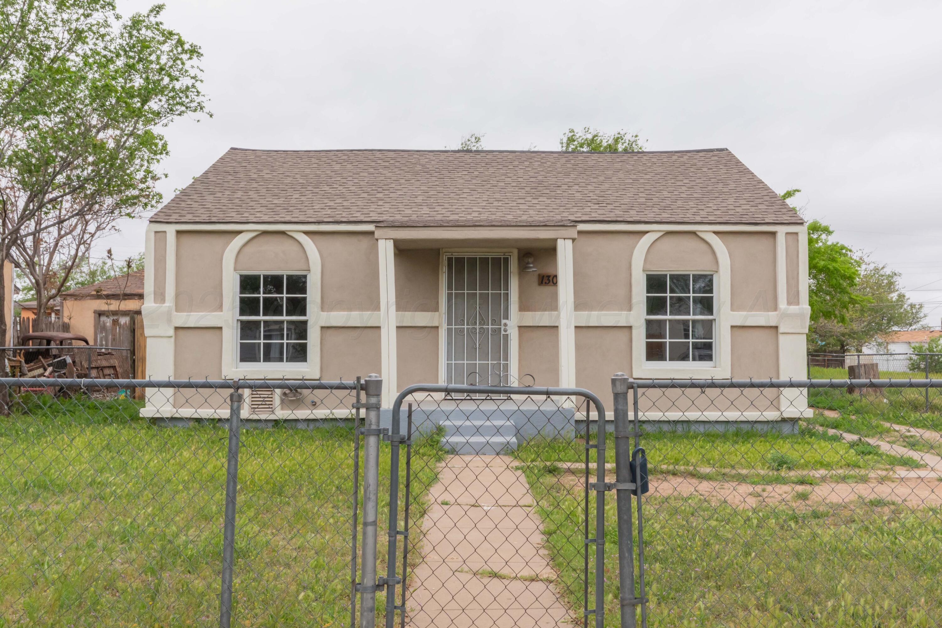 1307 North Buchanan Street Amarillo, TX 79107 - Photo 1 of 31 a front view of a house with a yard and porch