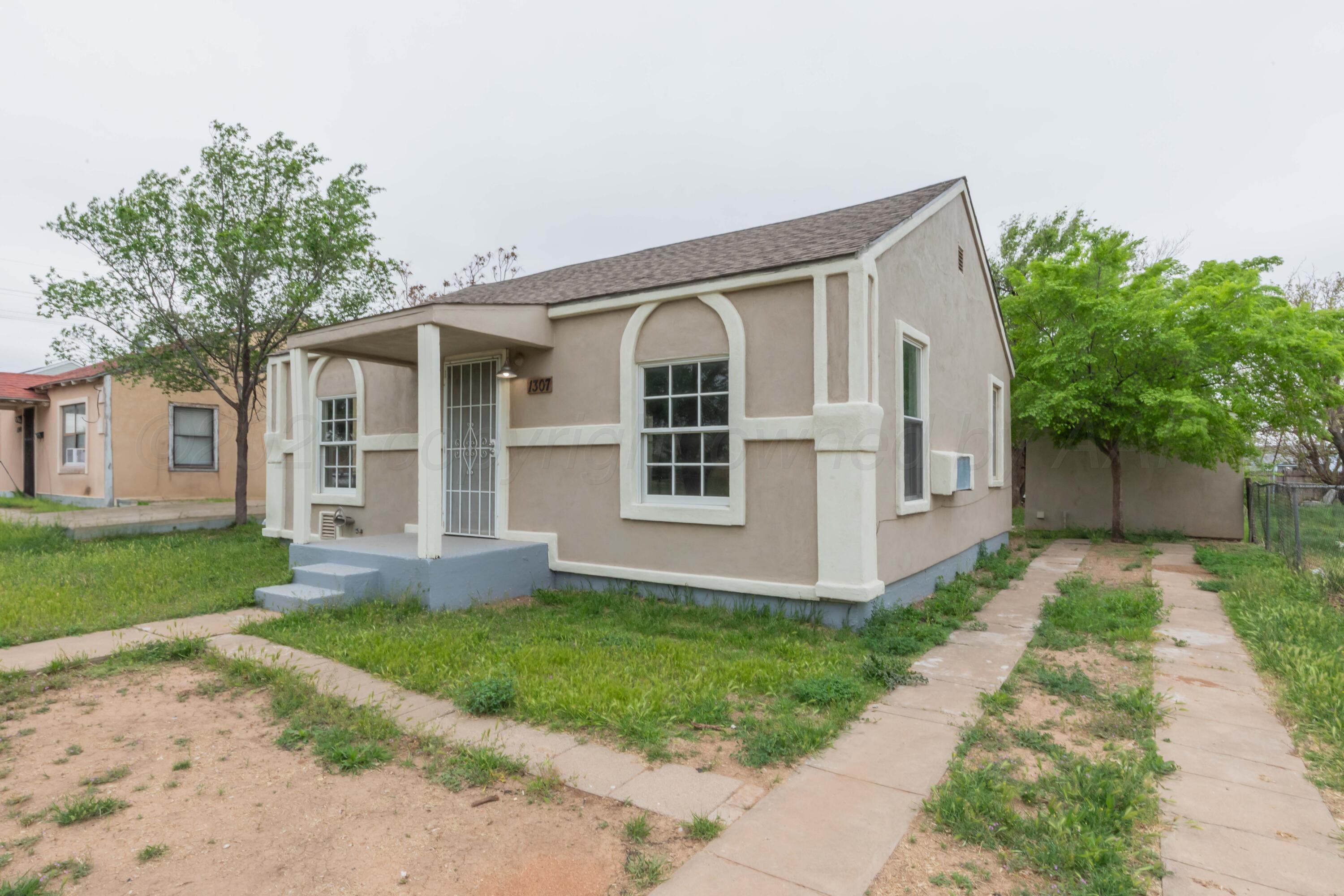 1307 North Buchanan Street Amarillo, TX 79107 - Photo 31 of 31 a view of house that has a yard
