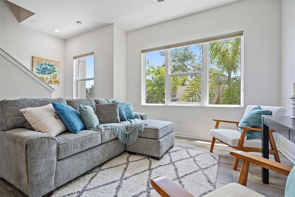 755 Calla Terrace North St. Petersburg, FL 33701 - Photo 11 of 37 a living room with furniture and a window