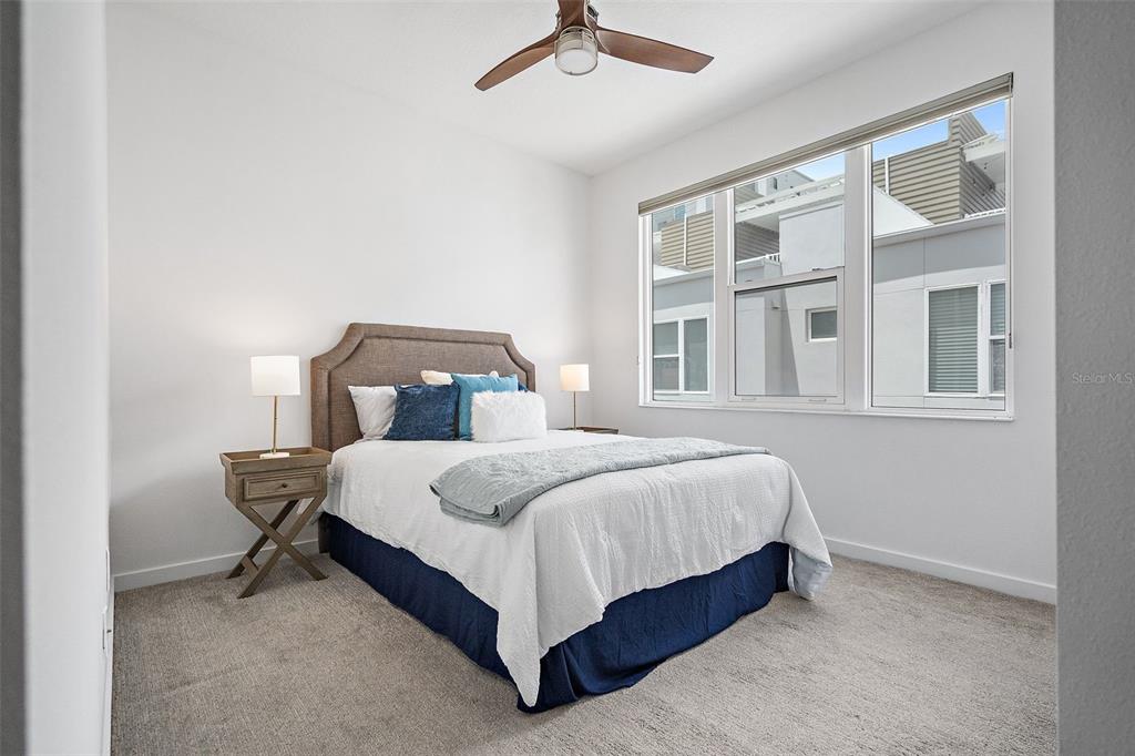 755 Calla Terrace North St. Petersburg, FL 33701 - Photo 17 of 37 a bed sitting in a bedroom next to a window