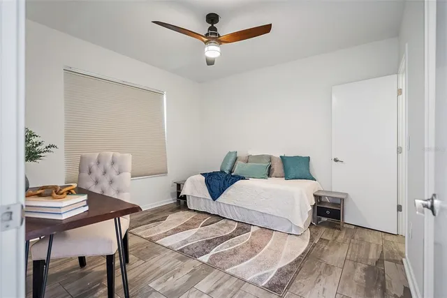 a bedroom with a bed and a table in it