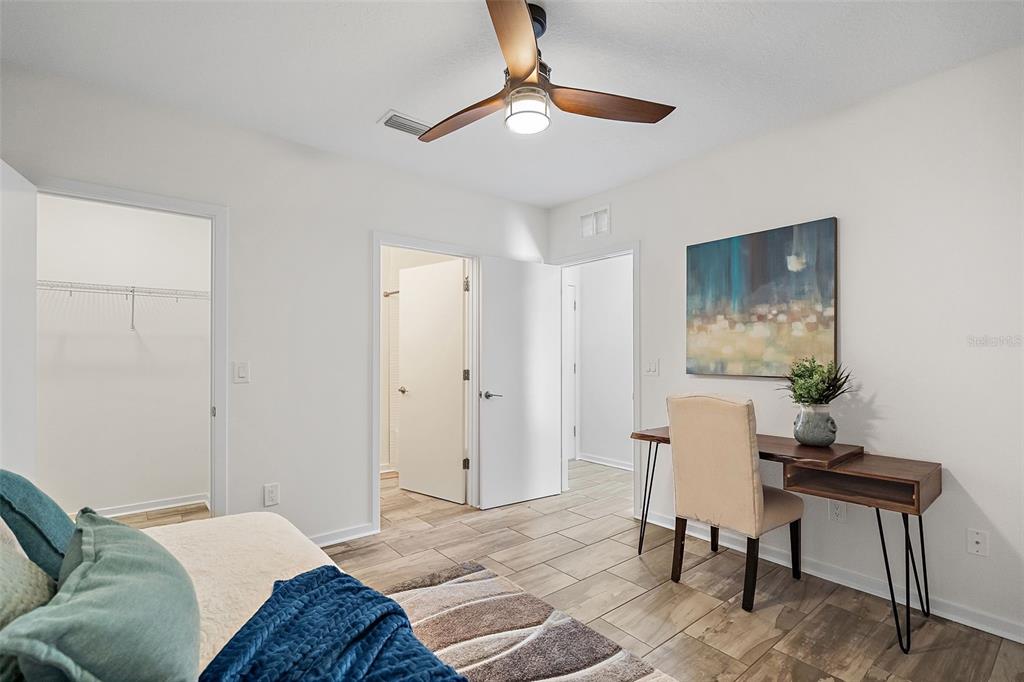 755 Calla Terrace North St. Petersburg, FL 33701 - Photo 21 of 37 a bedroom with a bed and a chair