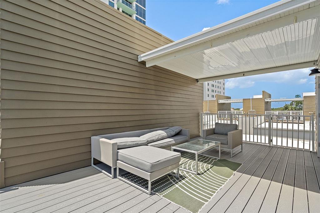 755 Calla Terrace North St. Petersburg, FL 33701 - Photo 24 of 37 a balcony with table and chairs