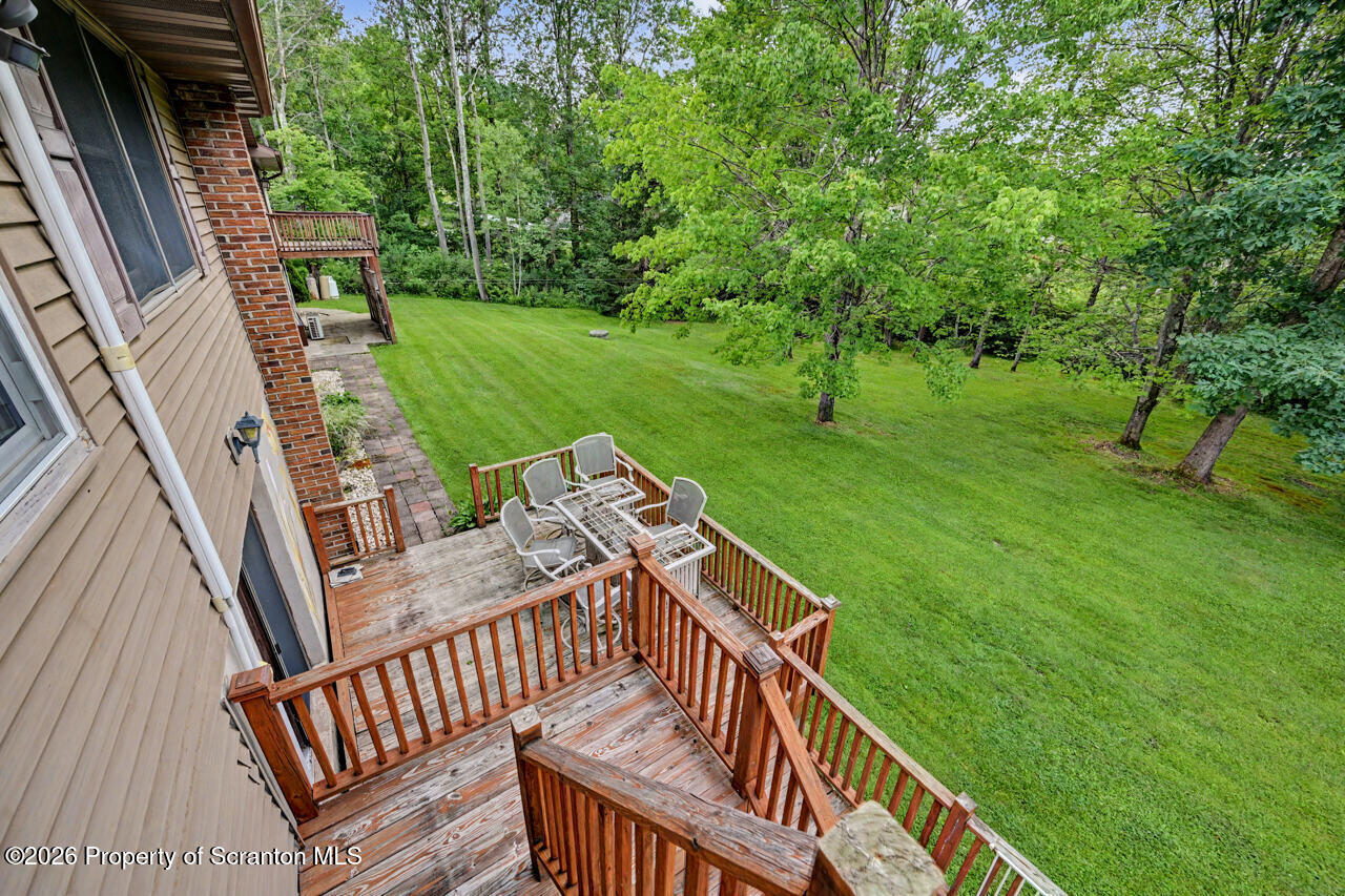 211 Buckingham Street Moscow, PA 18444 - Photo 34 of 83 a view of deck with a big yard potted plants and large tree