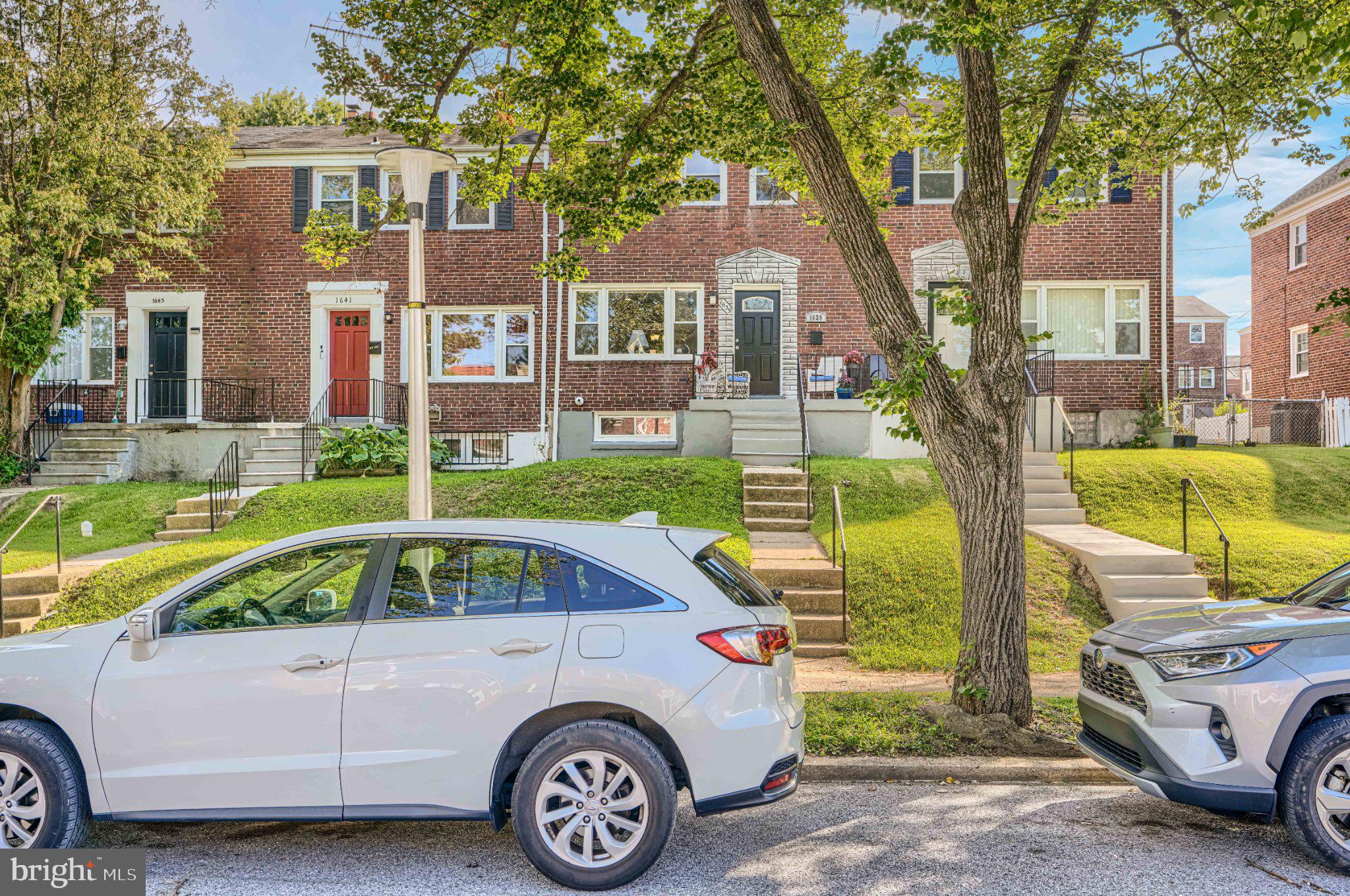 1639 Walterswood Road Baltimore, MD 21239 - Photo 4 of 49 Charming row homes with lush greenery.