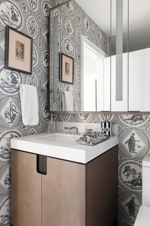 380 Harrison Avenue, Unit 12F Boston, MA 02118 - Photo 11 of 38 a bathroom with a sink and a mirror