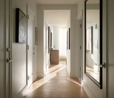 a view of a bathroom from a hallway