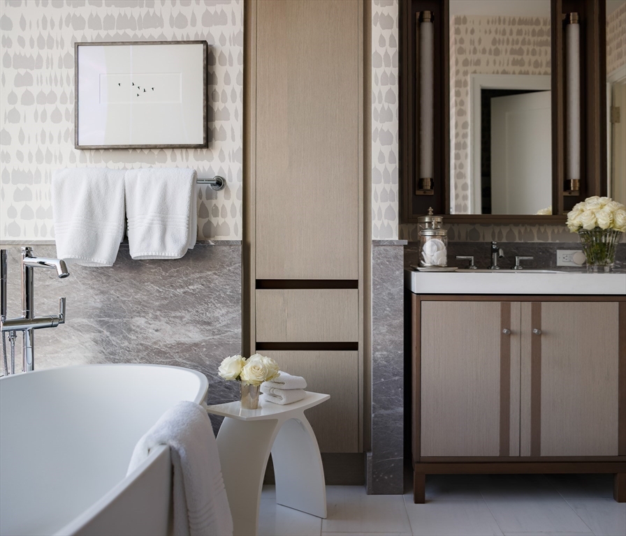 380 Harrison Avenue, Unit 12F Boston, MA 02118 - Photo 18 of 38 a bathroom with a sink and a mirror