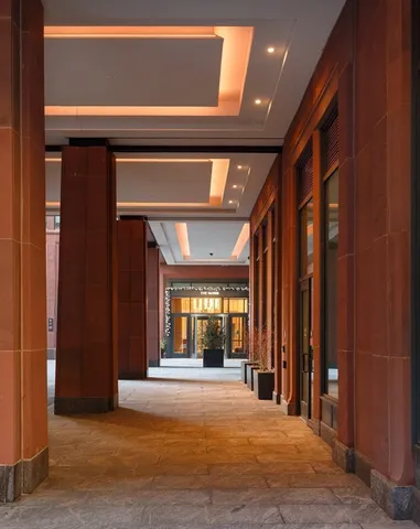 a building with potted plants in front of door