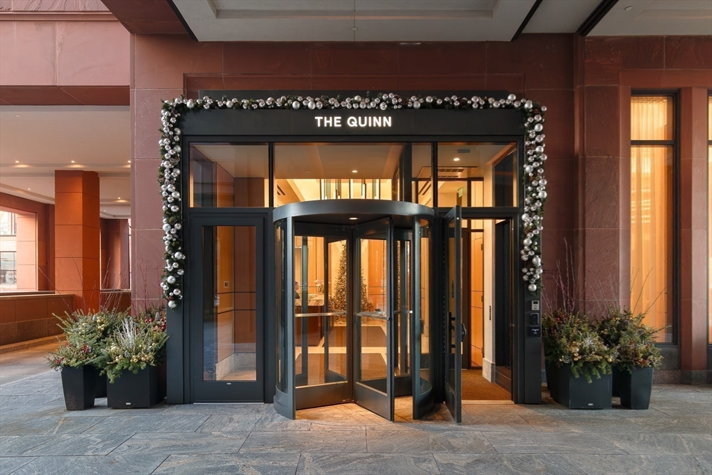 380 Harrison Avenue, Unit 12F Boston, MA 02118 - Photo 25 of 38 a building with potted plants in front of door