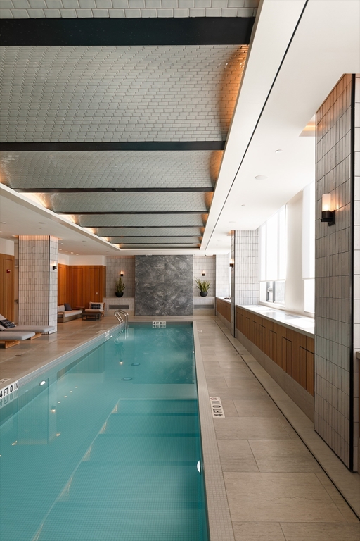 380 Harrison Avenue, Unit 12F Boston, MA 02118 - Photo 29 of 38 a living room with a table and chairs