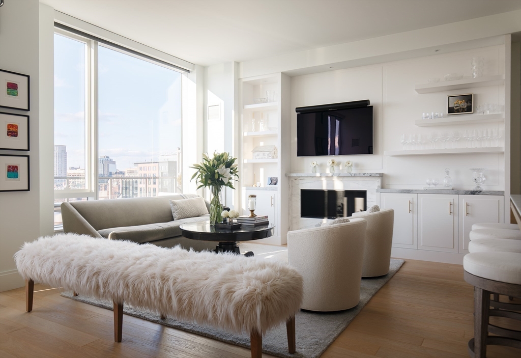 380 Harrison Avenue, Unit 12F Boston, MA 02118 - Photo 3 of 38 a living room with furniture fireplace and a large window