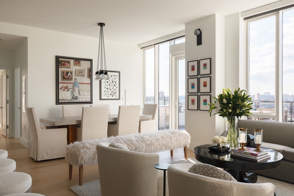 380 Harrison Avenue, Unit 12F Boston, MA 02118 - Photo 10 of 38 a living room with furniture and a large window