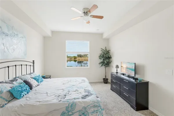 a bedroom with a bed dresser and a window