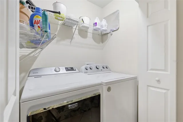 a utility room with dryer and washer