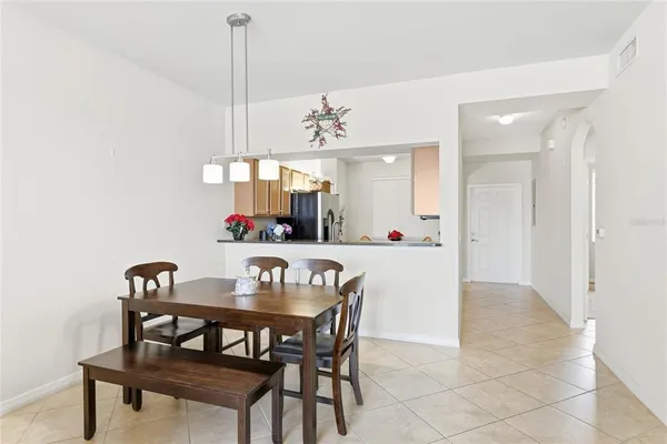 a view of a dining room with furniture and chandelier