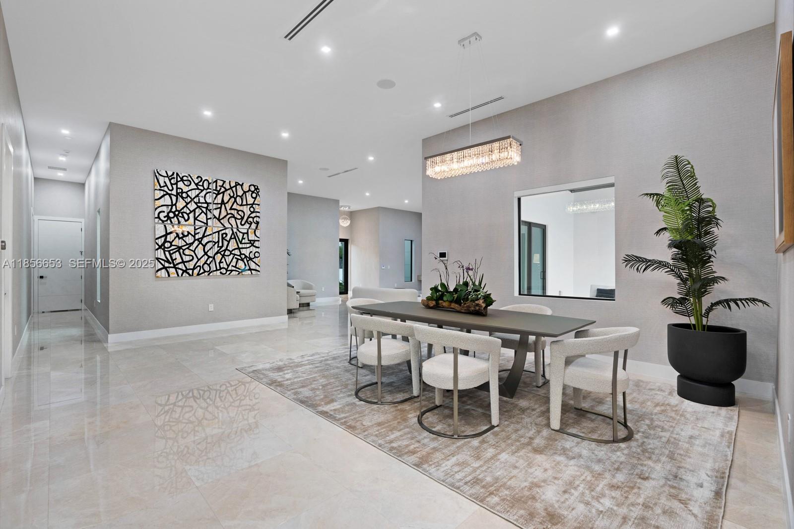 80 Northwest 129th Avenue Miami, FL 33182 - Photo 12 of 34 a living room with furniture a potted plant and a table
