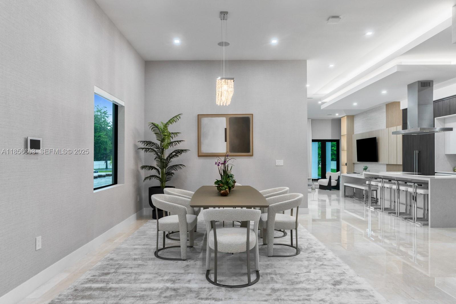 80 Northwest 129th Avenue Miami, FL 33182 - Photo 13 of 34 a dining room with furniture and wooden floor
