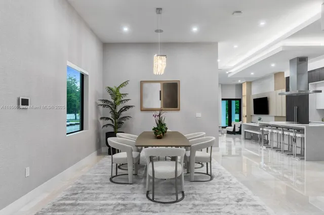 a dining room with furniture and wooden floor