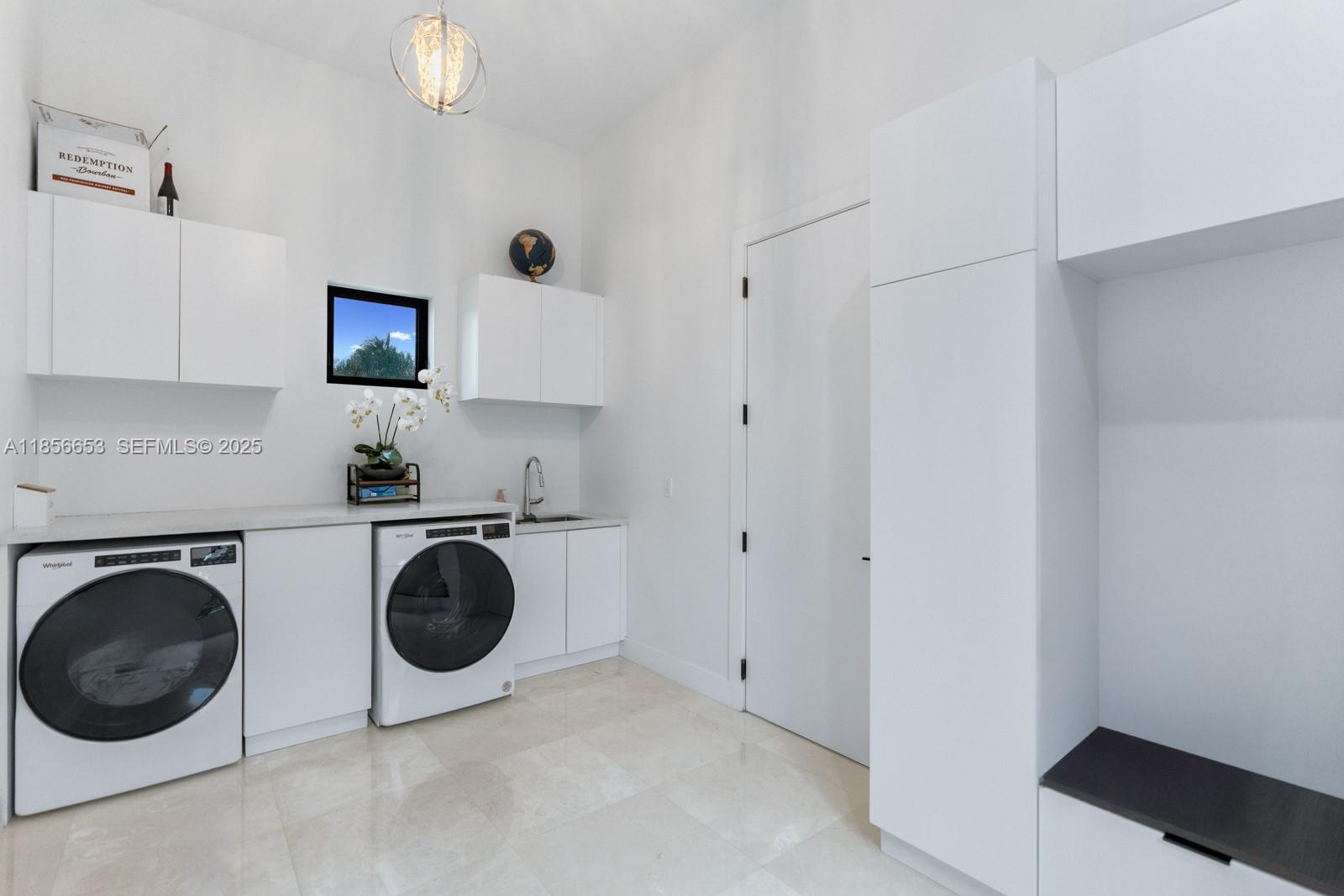 80 Northwest 129th Avenue Miami, FL 33182 - Photo 25 of 34 a view of a kitchen with washer and dryer