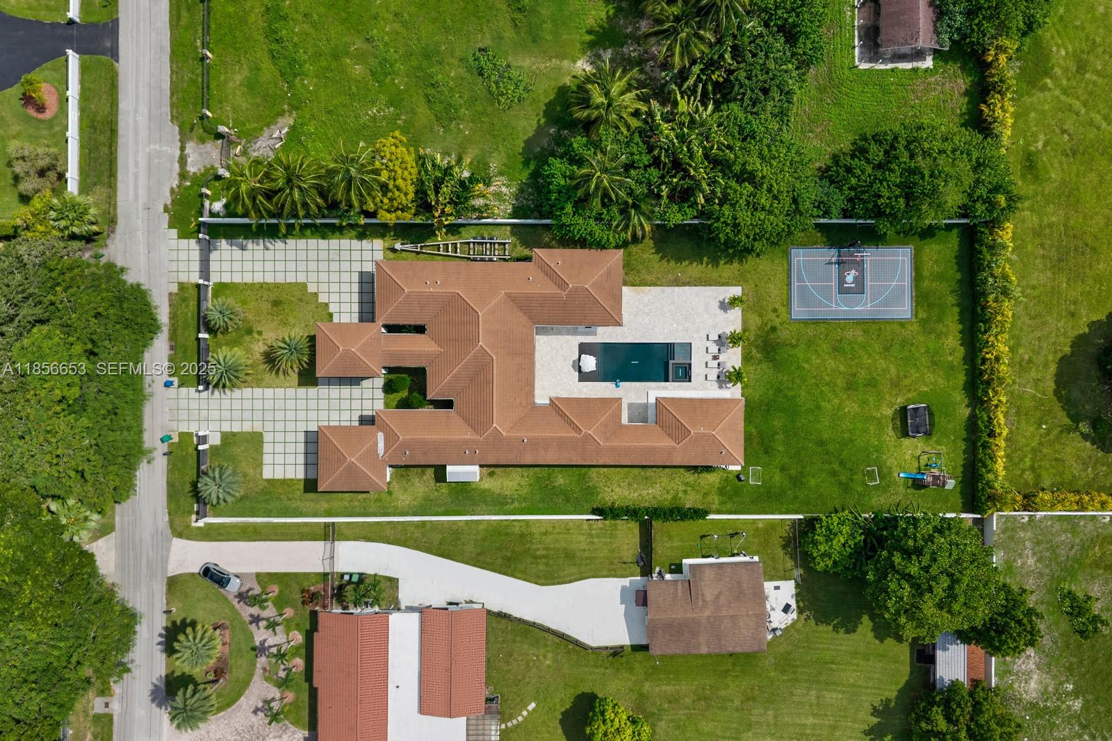80 Northwest 129th Avenue Miami, FL 33182 - Photo 29 of 34 an aerial view of a house with a garden and lake view