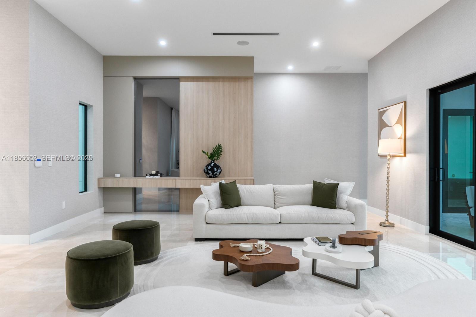 80 Northwest 129th Avenue Miami, FL 33182 - Photo 3 of 34 a living room with furniture and a large window