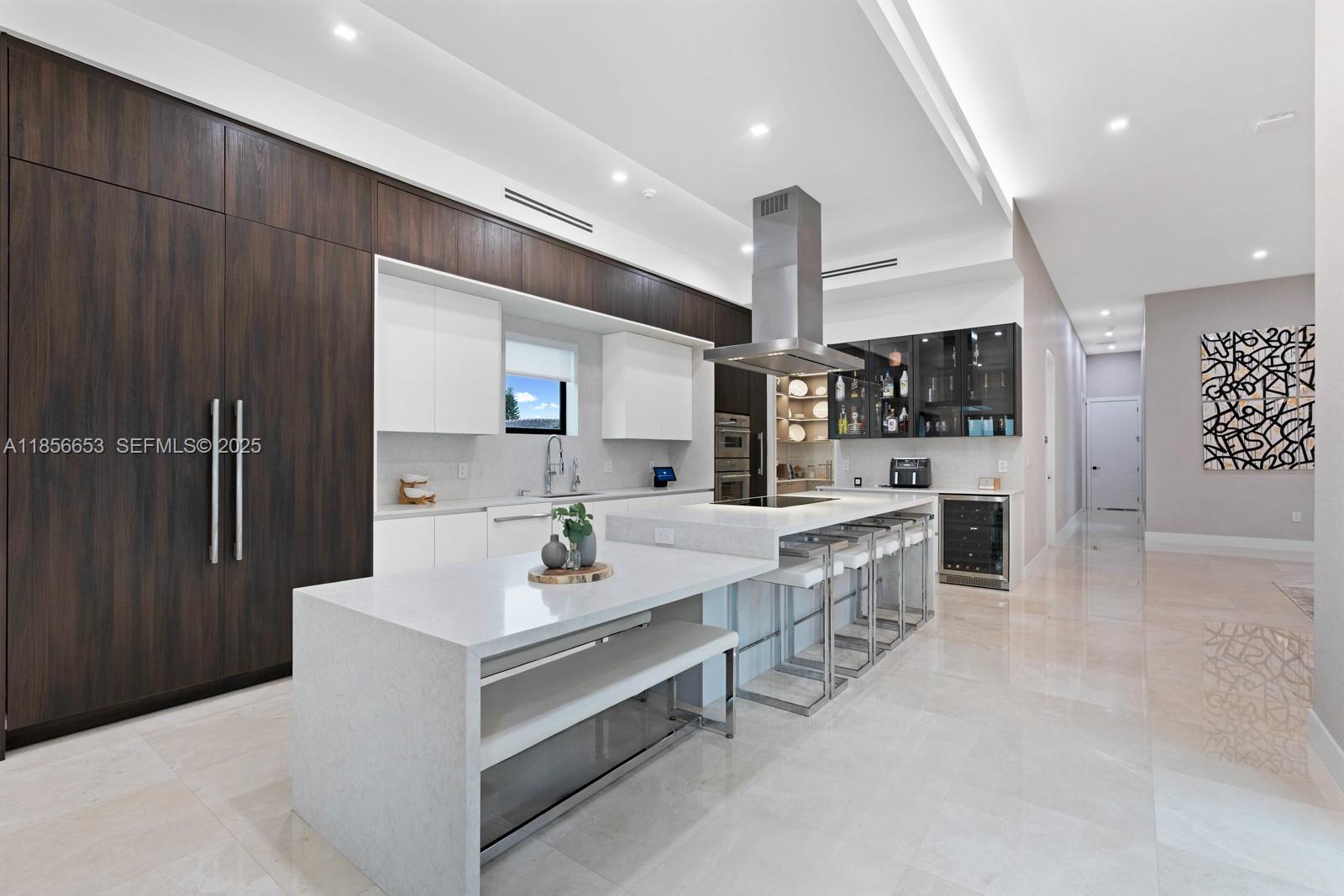 80 Northwest 129th Avenue Miami, FL 33182 - Photo 8 of 34 a large white kitchen with a large counter top appliances and cabinets