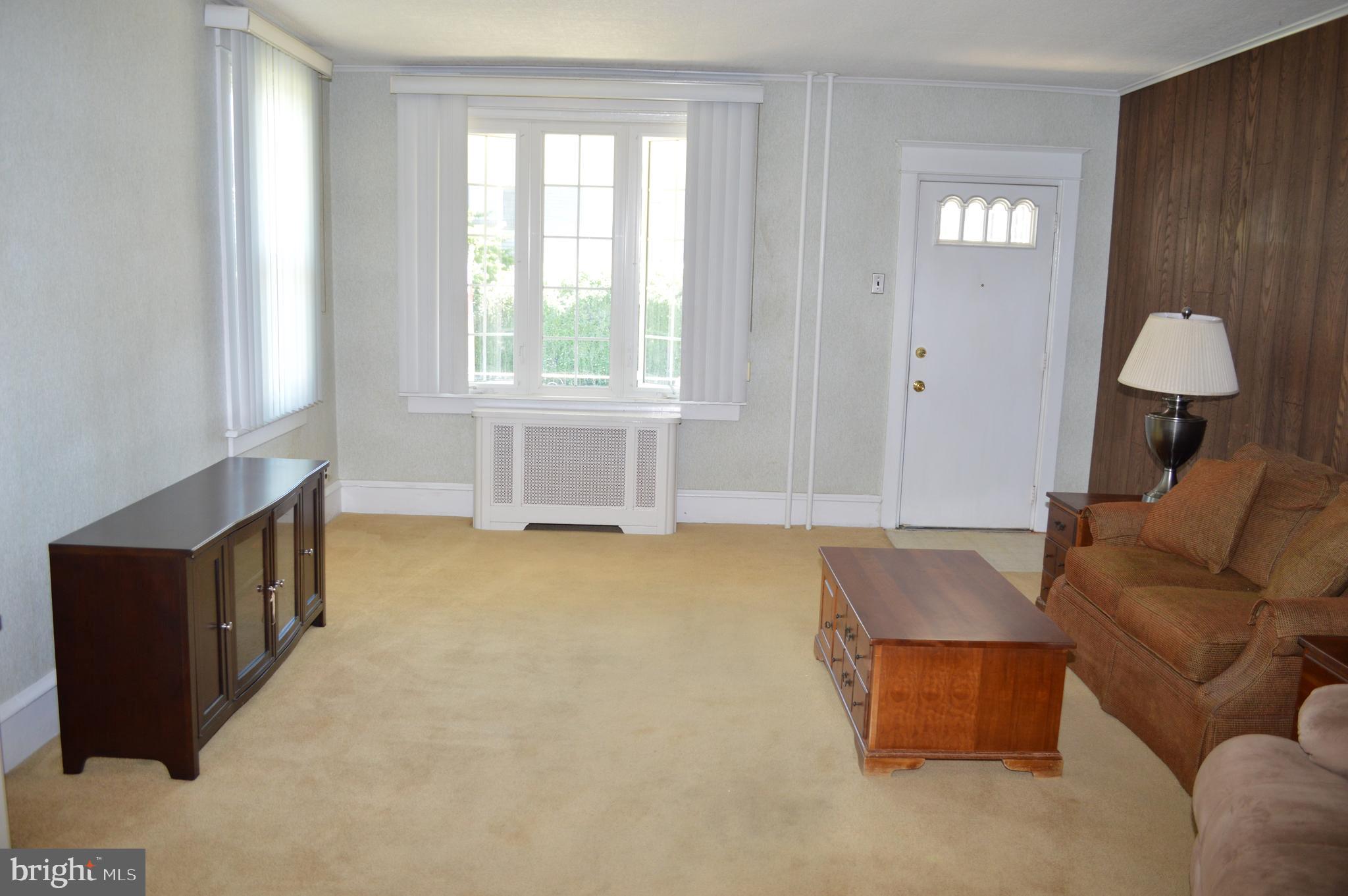 204 Ryers Avenue Cheltenham, PA 19012 - Photo 12 of 51 a living room with furniture and a window