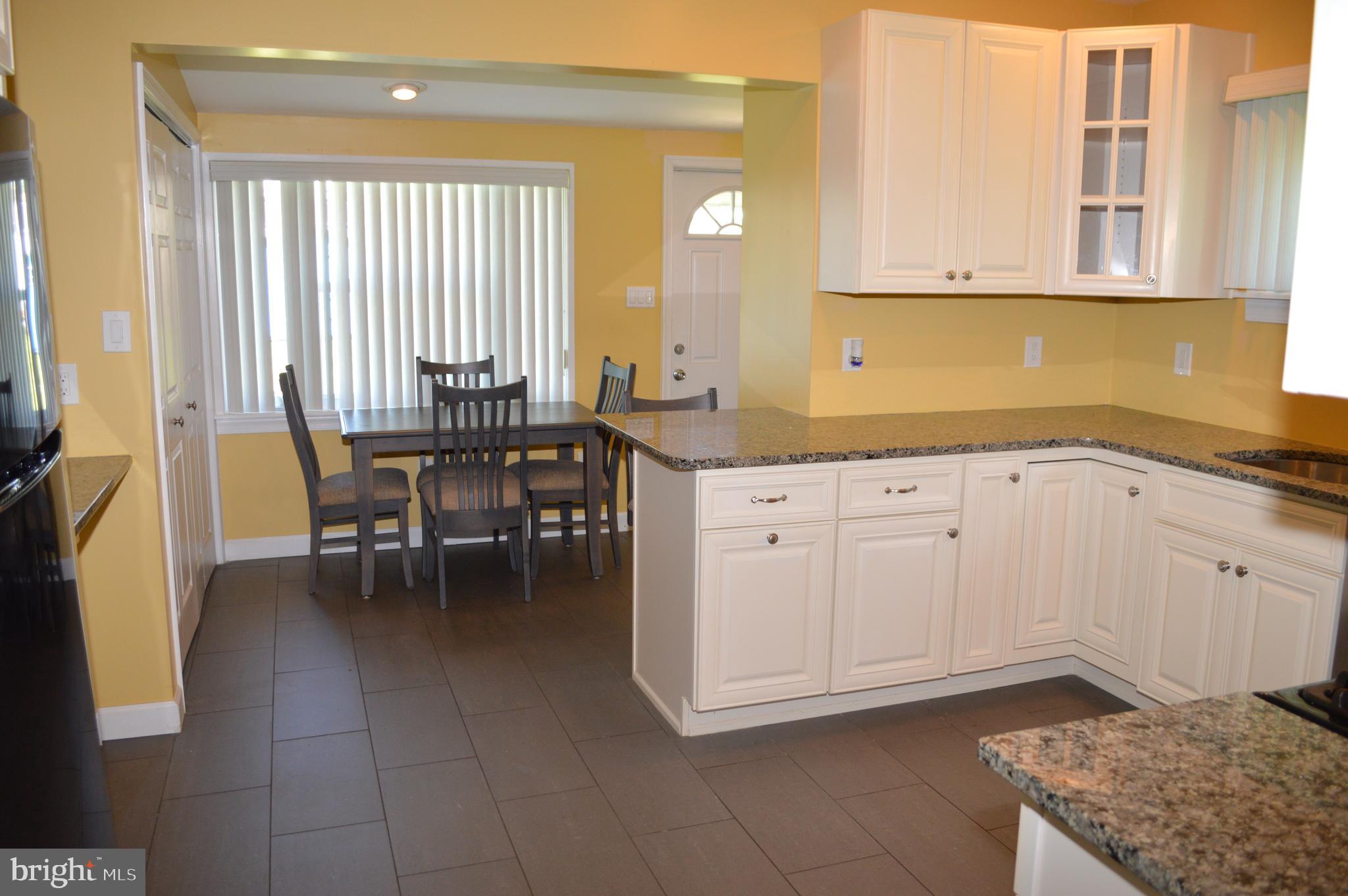 204 Ryers Avenue Cheltenham, PA 19012 - Photo 20 of 51 a kitchen with a cabinets and window