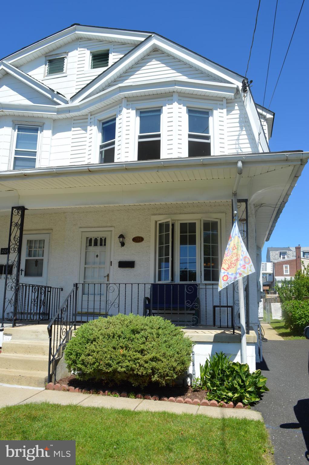 204 Ryers Avenue Cheltenham, PA 19012 - Photo 2 of 51 a front view of a house with a yard