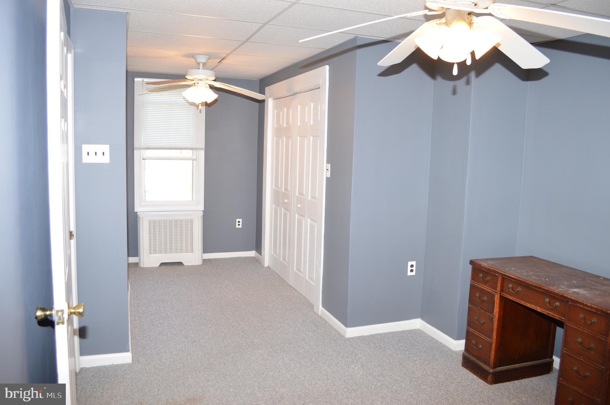 204 Ryers Avenue Cheltenham, PA 19012 - Photo 32 of 51 a view of an empty room with a chandelier fan