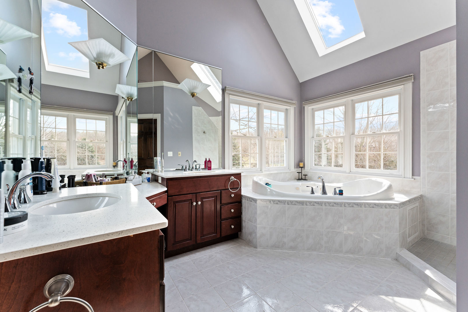 5-n098 Maple Court St. Charles, IL 60175 - Photo 20 of 34 a large kitchen with kitchen island a sink stainless steel appliances and cabinets