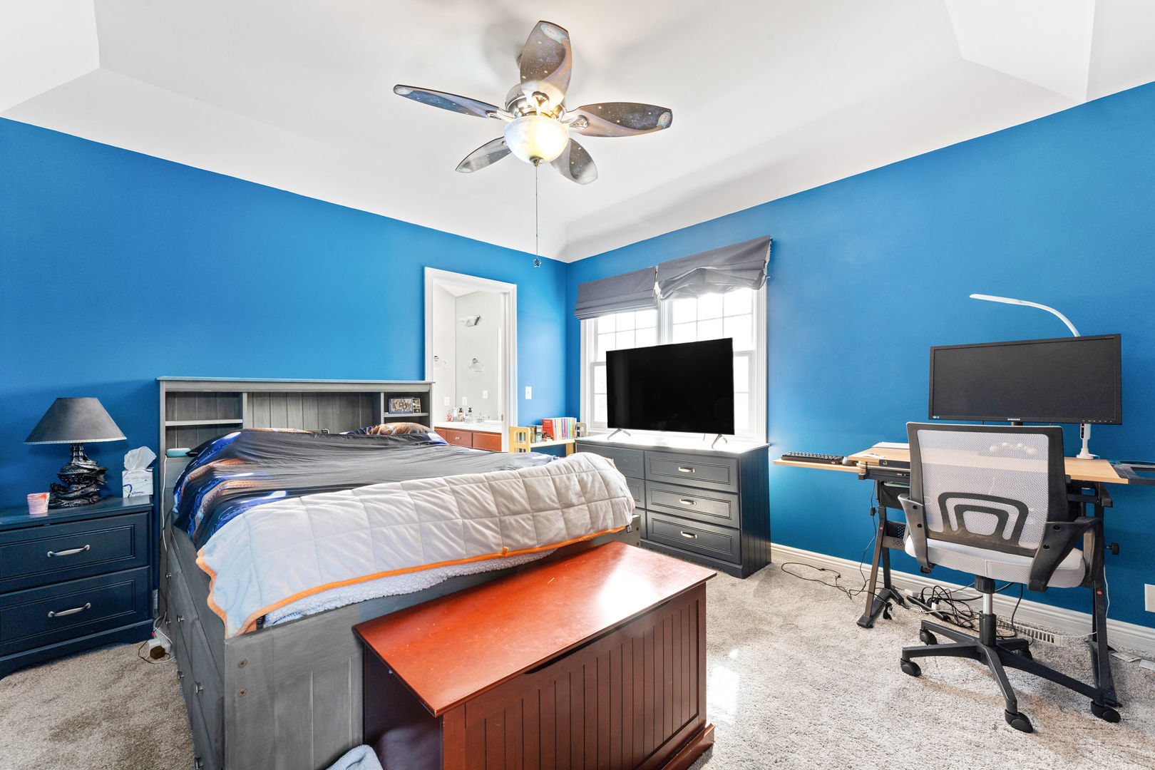 5-n098 Maple Court St. Charles, IL 60175 - Photo 23 of 34 a bedroom with a bed and a flat screen tv