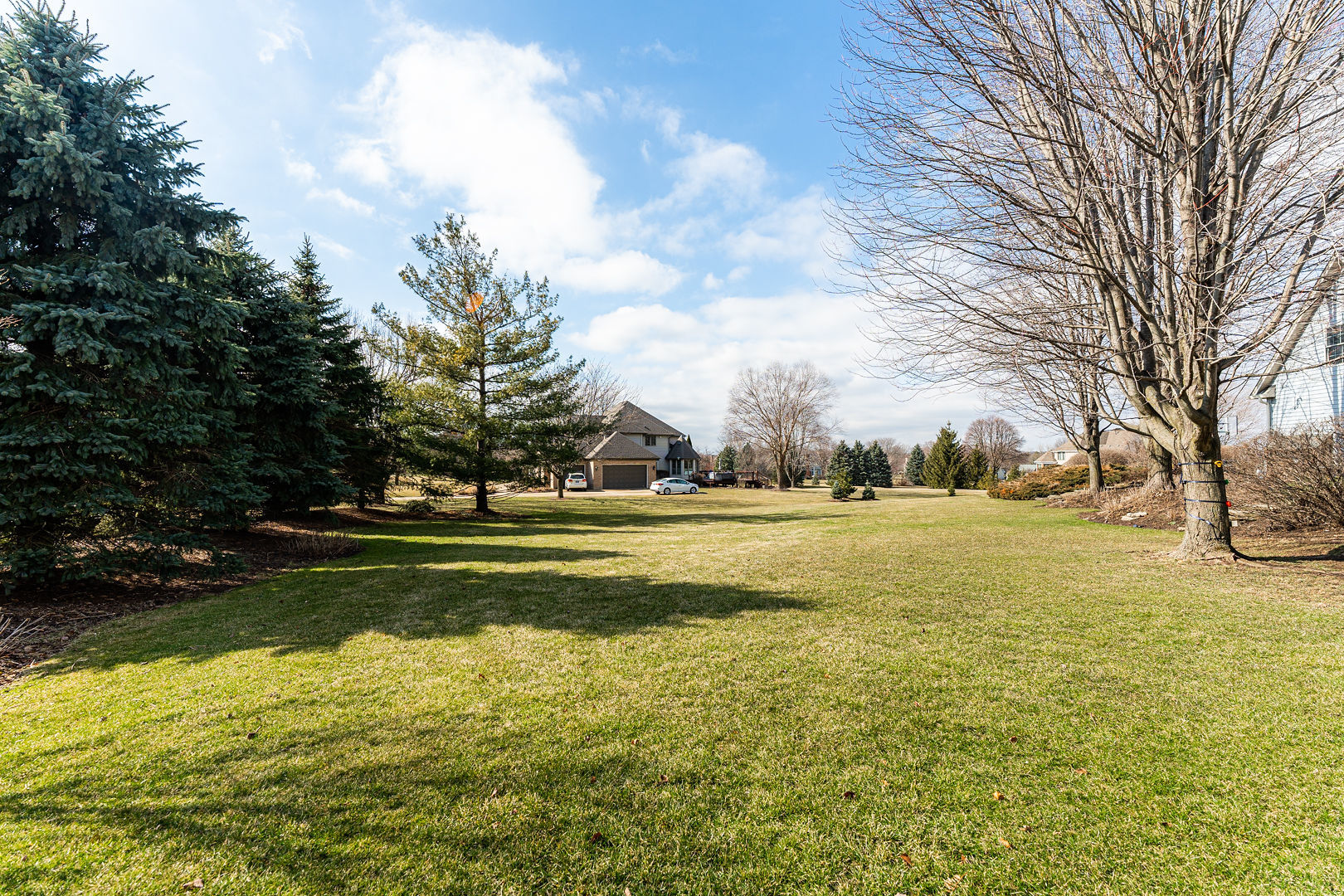 5-n098 Maple Court St. Charles, IL 60175 - Photo 32 of 34 a view of big yard with large trees