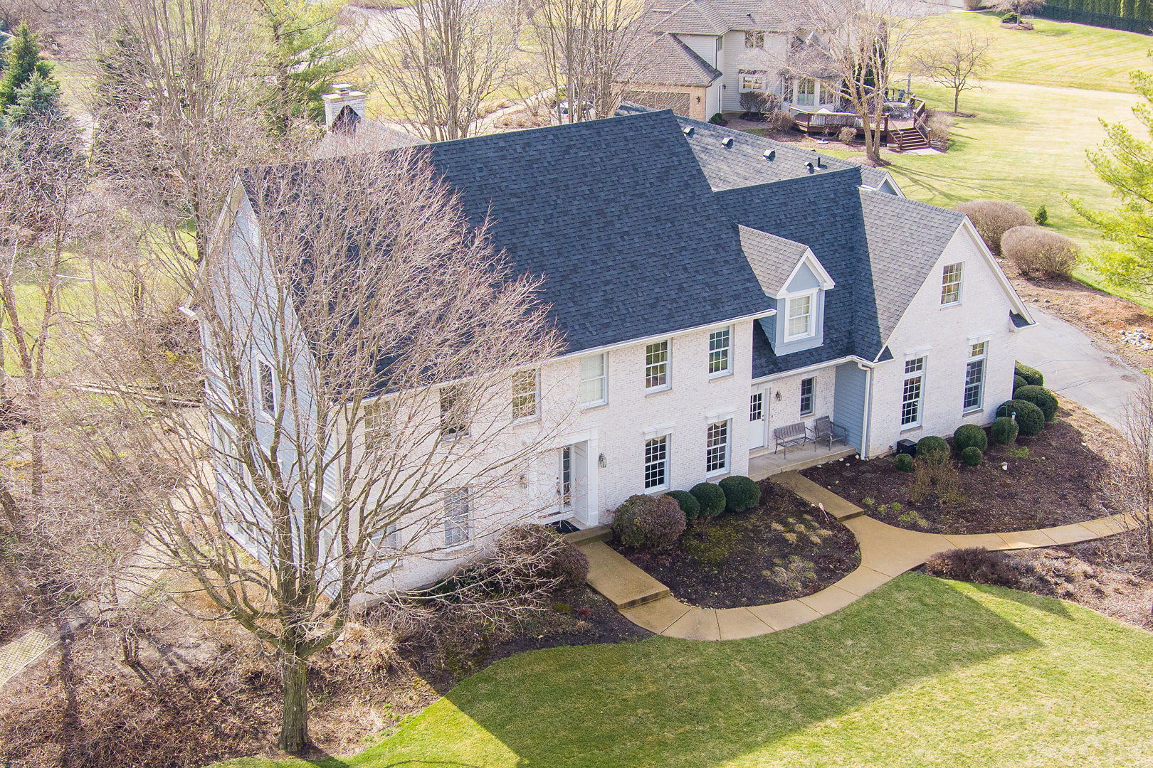 5-n098 Maple Court St. Charles, IL 60175 - Photo 5 of 34 a view of a big house with a yard