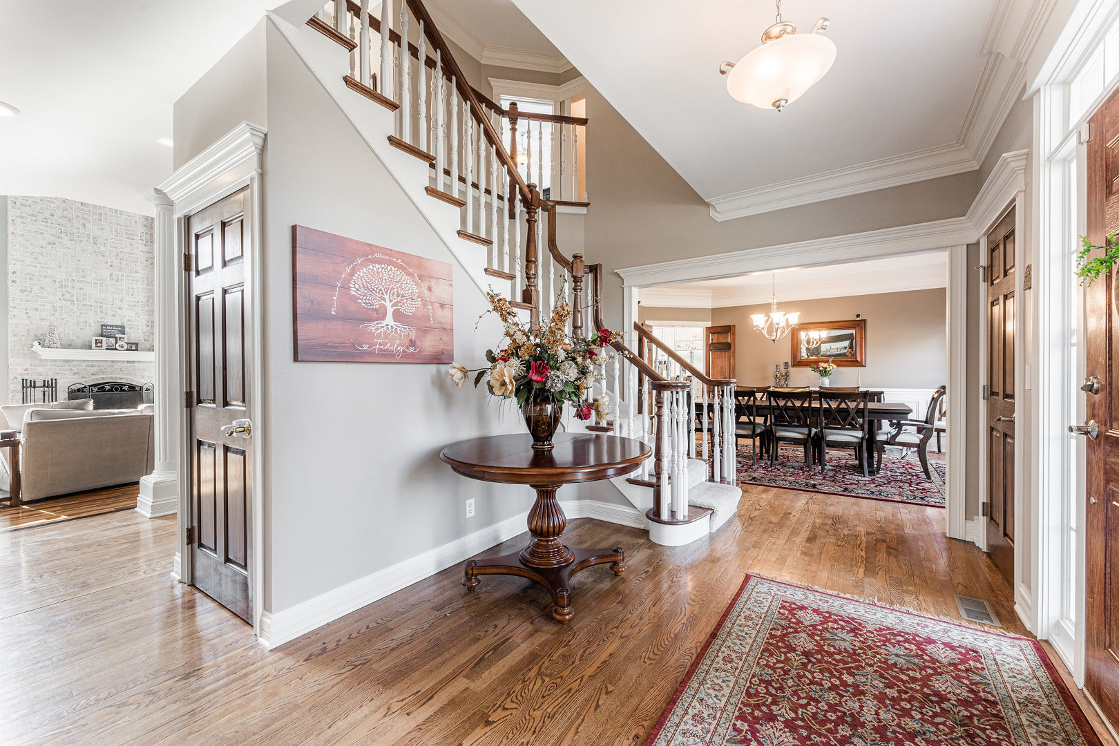 5-n098 Maple Court St. Charles, IL 60175 - Photo 7 of 34 a view of a livingroom dining room and hall way with wooden floor