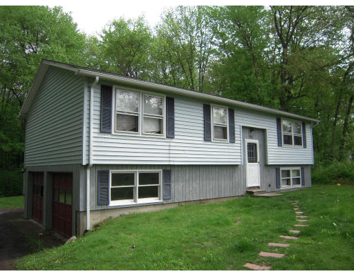 98 Pelham Road Amherst, MA 01002 - Photo 1 of 2 a front view of a house with a garden