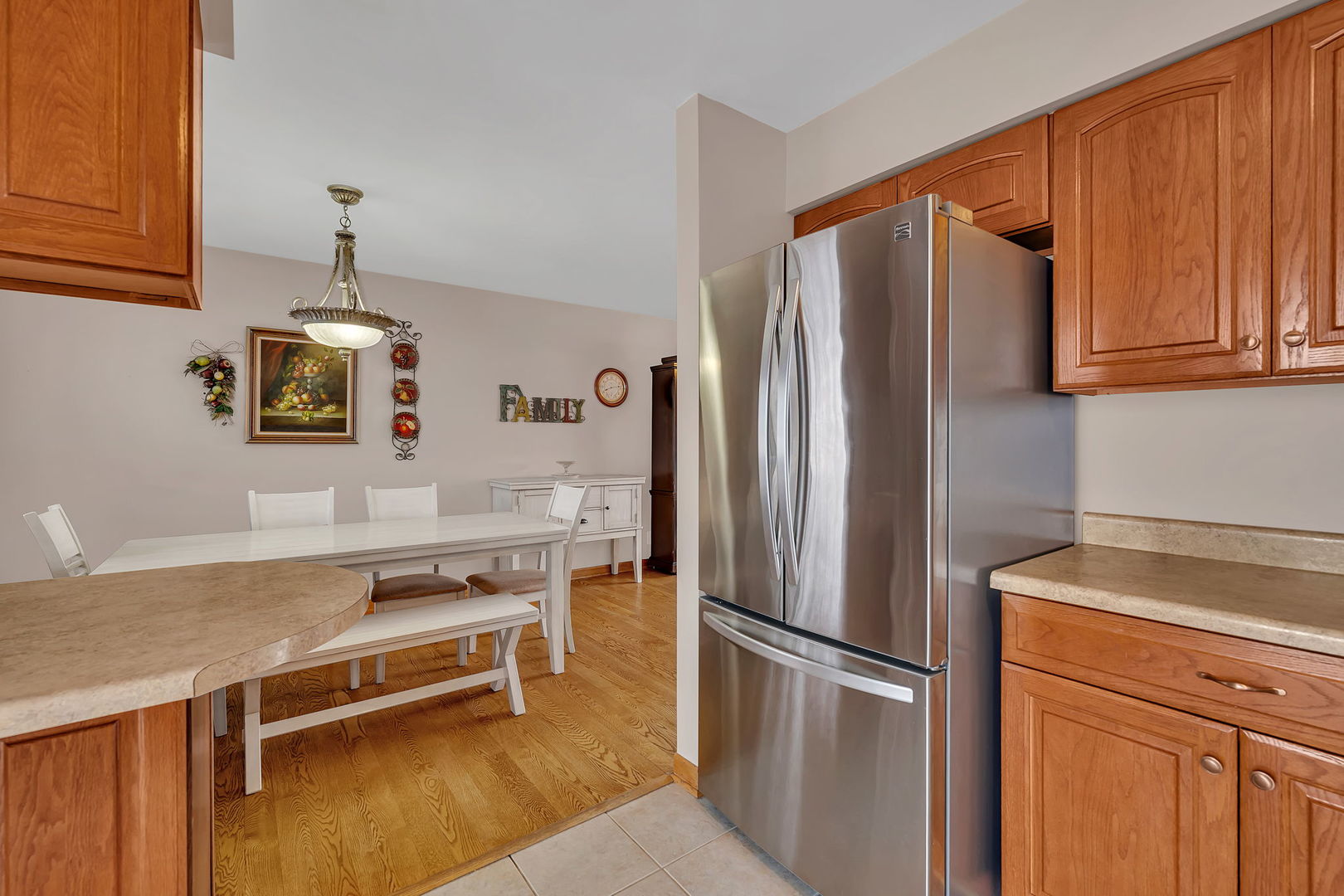 700 Evergreen Court Romeoville, IL 60446 - Photo 11 of 27 a kitchen with stainless steel appliances granite countertop a refrigerator a stove and a sink with cabinets