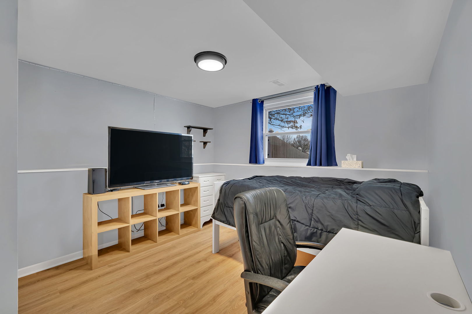 700 Evergreen Court Romeoville, IL 60446 - Photo 20 of 27 a bedroom with a bed and a flat screen tv